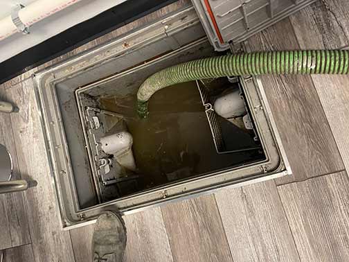 a kitchen grease trap cleaning and maintenance