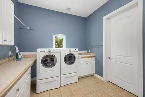 A washer and dryer in a laundry room.