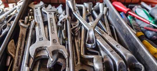 A toolbox full of tools used for dealing with clogged drains in your home.