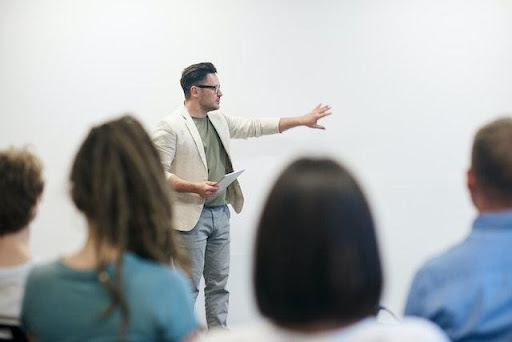 a man giving a speech on drain cleaning.