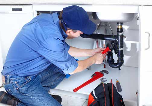 a plumber from a big chain plumbing company performing shoddy work.