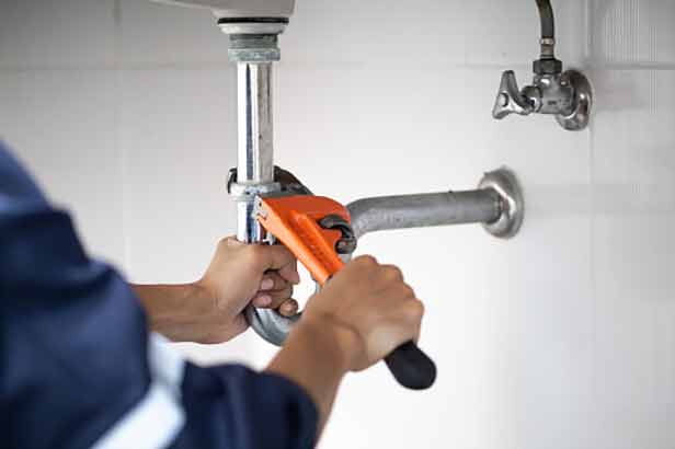 a plumber making repairs in burr ridge.