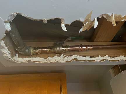 Burst pipe repair in Chicago Illinois showing emergency plumbing water leak repair
