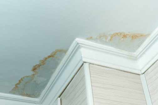 a ceiling with water damage in a new home.