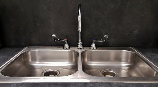 double kitchen sink backs up into other sink