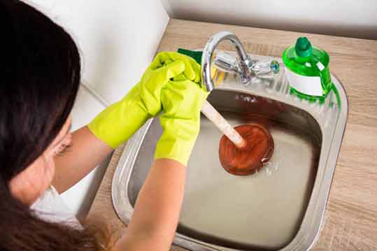 a women experiencing sewer backups.