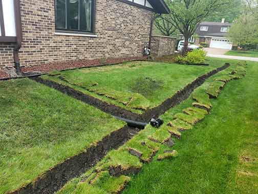 drainage tile being installed.