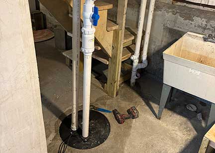 Ejector pump installation in Hinsdale Illinois showing wastewater pump system setup