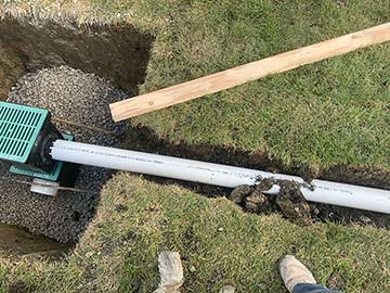 Flood control system installation Elmhurst Illinois overhead sewer protection