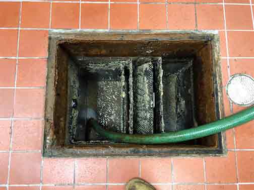 a completed grease trap cleaning service