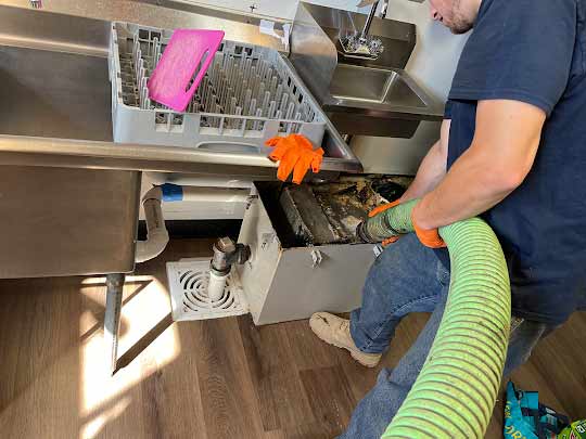 a grease trap being maintained in chicago