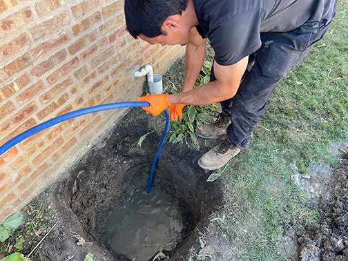 a darien plumber performing a hydro jetting service.