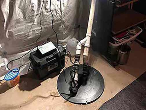 a freshly installed sump pump to combat basement flooding in chicagoland.