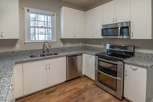 a kitchen with a double sided sink.