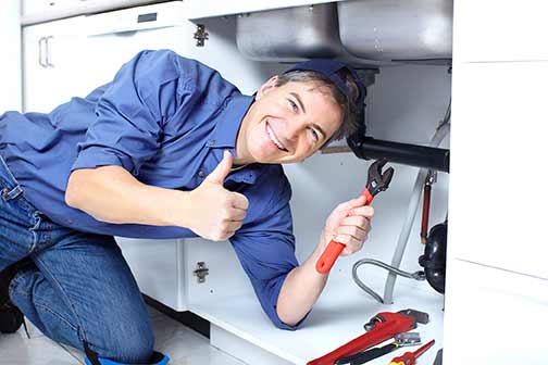 a local plumber giving a thumbs up