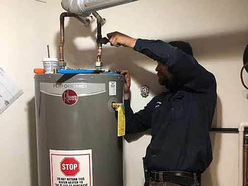 a neighborhood plumber installing a water heater