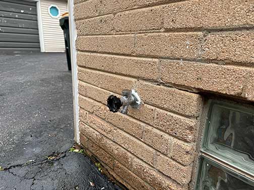 an outdoor water faucet
