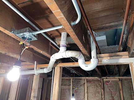 Overhead sewer installation in Chicago Illinois showing elevated sewer piping system work