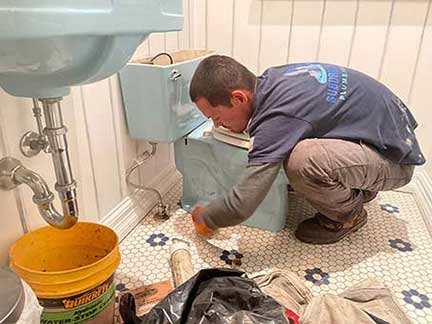 Plumber in Willowbrook Illinois performing plumbing repair and maintenance work