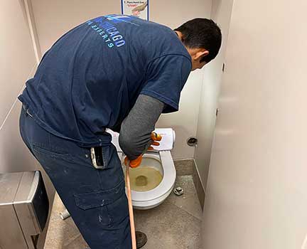 Plumber in Woodridge Illinois performing plumbing repair and maintenance work