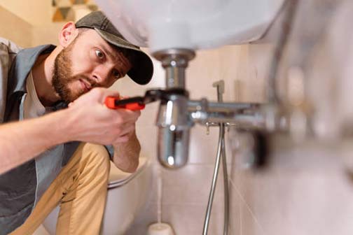 a plumber in westchester illinois making repairs