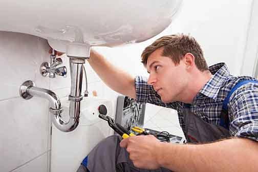 a professional plumber making repairs.