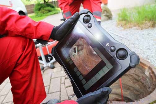 a plumber performing a sewer camera inspection.