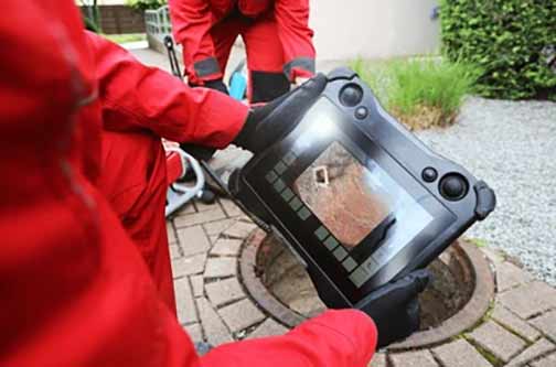 a plumber performing a sewer camera inspection