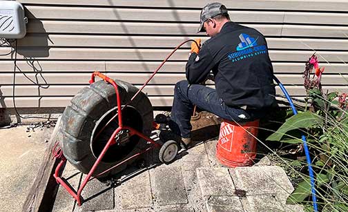 a plumber performing a sewer camera inspection