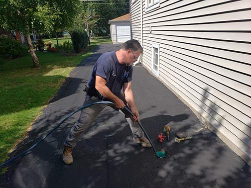 a plumber performing a sewer line cleaning for a customer in riverside illinois