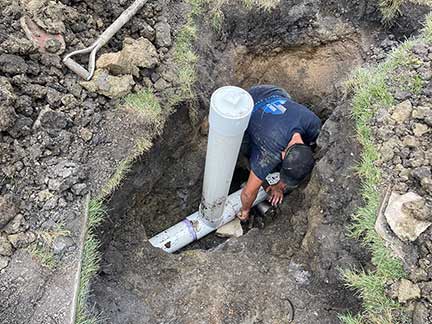 Sewer line repair in Oak Brook Illinois showing trench excavation and pipe replacement work