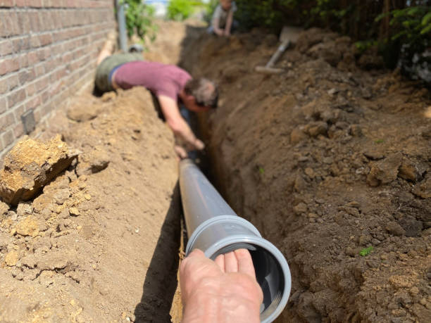 a plumber performing a sewer line replacement