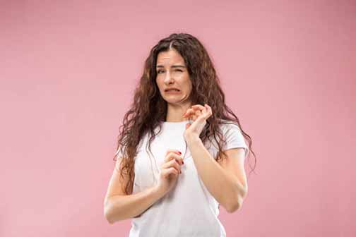 a woman smelling sewage odors in her home.