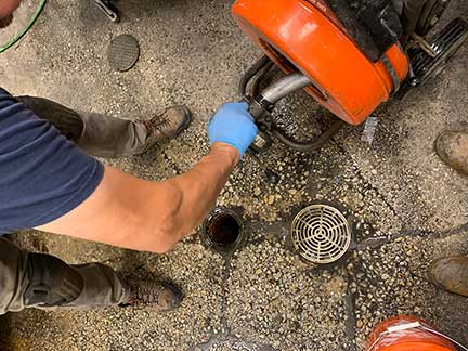 Professional sewer rodding in Chicago Illinois removing heavy drain and sewer buildup