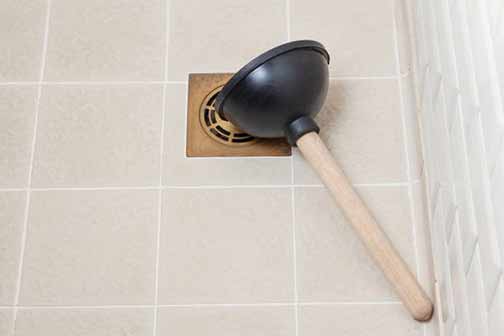 a shower plunger used to clear clogs.