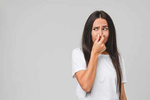 a woman with smelly drains