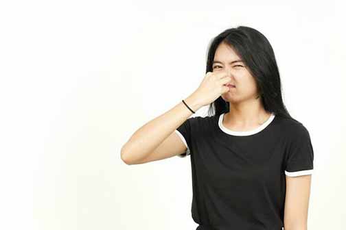 a woman with stinky drains.