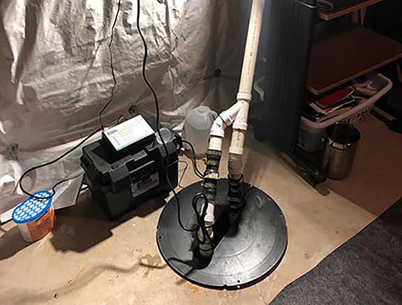 a sump pump system with a battery backup