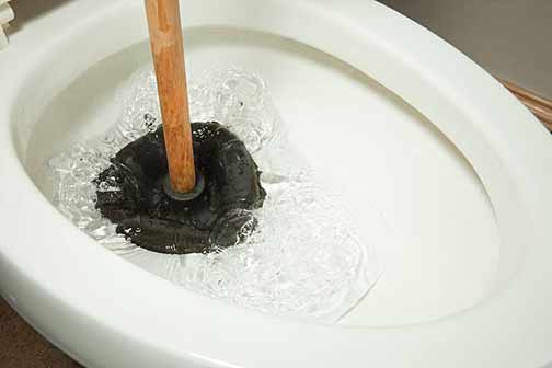 a toilet clog in a rental apartment