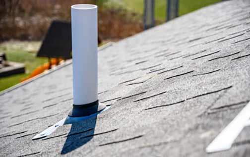 a vented plumbing stack on a roof