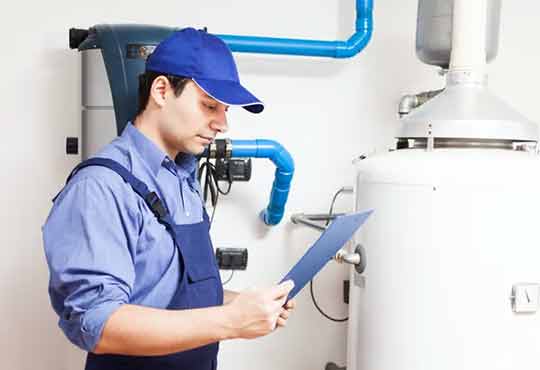 a plumber maintaining a water heater.