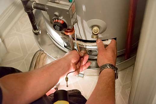 a plumber fixing water heater malfunctions.