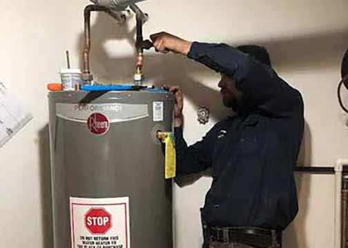 a professional plumber replacing a water heater