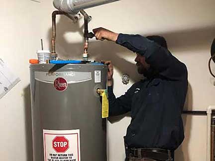 Water heater replacement in Darien Illinois showing old unit removal and new installation