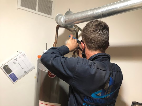 a water heater installation taking place by a plumber in chicago.