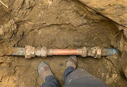 Water line repair in Cicero Illinois with trench excavation and pipe restoration work