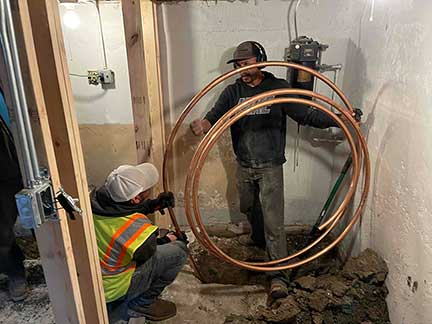 Water line replacement in Chicago Illinois showing excavation and underground pipe repair